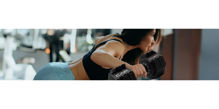 woman weight lifting with patented CAP adjustable dumbbells