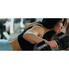 woman weight lifting with patented CAP adjustable dumbbells